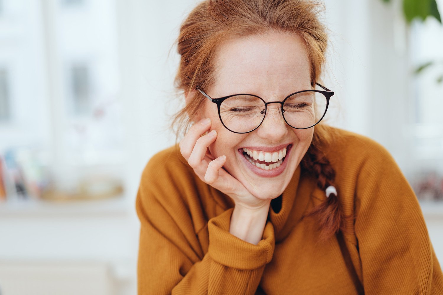 Woman laughs after recieving professional urgent eye care in Decatur & Hartselle
